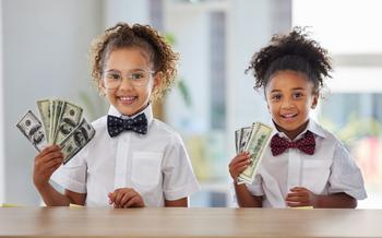 Are You Missing Out on These 2 Recent Dividend Raises?: https://g.foolcdn.com/editorial/images/783128/2-kids-holding-american-currency.jpg