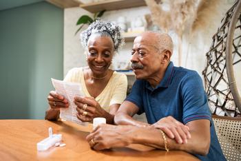 Could Claiming Social Security Early Increase Your Lifetime Benefit?: https://g.foolcdn.com/editorial/images/774565/couple-sitting-at-table-looking-at-document.jpg