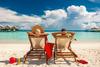 Carnival Cruise Lines: Buy, Sell, or Hold?: https://g.foolcdn.com/editorial/images/737311/gettyman-and-woman-relaxing-in-lounge-chairs-on-a-beach-in-the-maldives.jpg