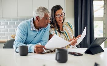 The Best Reason to Take Social Security Long Before Age 70: https://g.foolcdn.com/editorial/images/783077/gettyimages-senior-couple-looking-at-papers.jpg