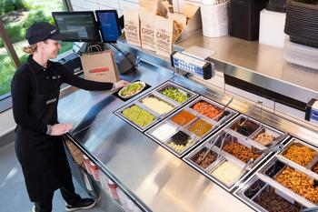 Would You Eat a Burrito Bowl Made by Robots? Chipotle Mexican Grill Sure Hopes So: https://g.foolcdn.com/editorial/images/749657/a-chipotle-worker-preps-food-at-a-test-kitchen.jpg