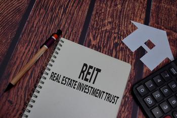 Realty Income Stock: Buy, Sell, or Hold?: https://g.foolcdn.com/editorial/images/757684/a-notebook-calculator-and-the-word-reit-1200x800-5b2df79.jpg