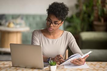 Got $50 Per Week? How the Stock Market Could Turn It Into $497,000: https://g.foolcdn.com/editorial/images/751127/person-looking-at-a-laptop-and-holding-a-book.jpg