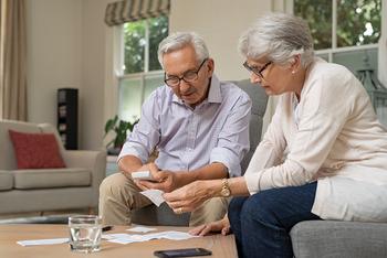 The Best Reason to Take Social Security Long Before Age 70: https://g.foolcdn.com/editorial/images/735609/retired-couple-looking-at-financial-paperwork.jpg