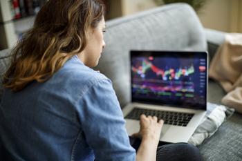 2 Unstoppable Dividend Growth Stocks You Can Buy Now With $100: https://g.foolcdn.com/editorial/images/789906/investor-sofa-laptop-getty.jpg