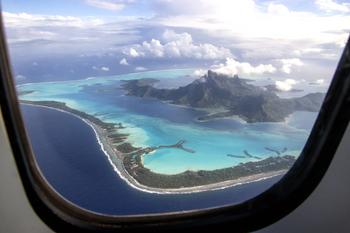 Why Hawaiian Holdings Stock Swooned Today: https://g.foolcdn.com/editorial/images/749616/view-of-idyllic-sea-and-land-from-the-window-of-an-airplane.jpg