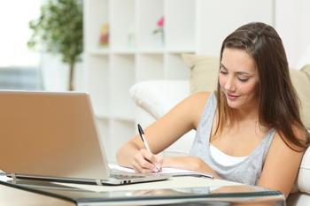 Shopify Stock: Buy, Hold or Sell?: https://g.foolcdn.com/editorial/images/786432/young-woman-student-writing-in-front-of-computer.jpg