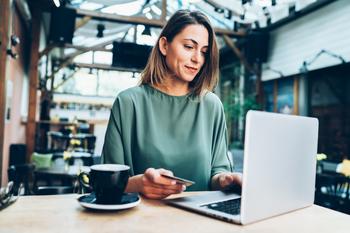 Is Apple Stock a Buy Now?: https://g.foolcdn.com/editorial/images/754844/person-sitting-in-a-cafe-on-their-laptop.jpg