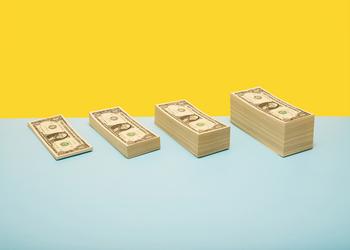 1 Retirement Savings Hack That Has Created Many Millionaires and Will Continue to Make More: https://g.foolcdn.com/editorial/images/779069/stacks-of-dollar-bills.jpg