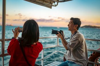 Better Cruise Line Stock: Royal Caribbean vs. Norwegian: https://g.foolcdn.com/editorial/images/779668/couple-enjoys-sunset-cruise.jpg