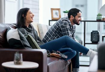 3 Roku Stock Predictions for 2023: https://g.foolcdn.com/editorial/images/716252/young-couple-sitting-on-the-couch-watching-television.jpg