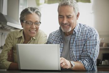 2 Top "Magnificent Seven" Artificial Intelligence (AI) Stocks to Buy With $500 and Hold for the Long Term: https://g.foolcdn.com/editorial/images/770304/gettyimages-two-people-smile-and-look-at-computer.jpg