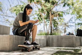 Why Zumiez Stock Popped Today: https://g.foolcdn.com/editorial/images/789912/a-woman-with-a-skateboard-looking-at-a-phone.jpg