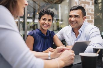 2 Growth Stocks Wall Street Thinks Can Soar 90%: https://g.foolcdn.com/editorial/images/736726/a-couple-smiling-and-talking-with-an-advisor.jpg