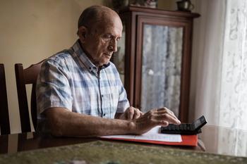 Surprise! If You're a Medicare Enrollee, You May Have to Pay for These Expenses on Your Own.: https://g.foolcdn.com/editorial/images/761766/older-man-calculator-gettyimages-1205262520.jpg