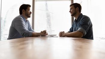 Atlassian Stock: Bear Vs. Bull: https://g.foolcdn.com/editorial/images/716752/two-business-people-appear-to-be-in-opposition-sitting-across-from-each-other.jpg