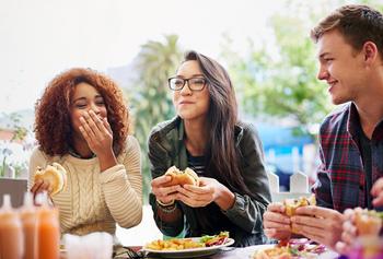 3 Reasons to Avoid Beyond Meat Stock Like the Plague: https://g.foolcdn.com/editorial/images/772613/three-friends-eating-burgers-outdoors.jpg