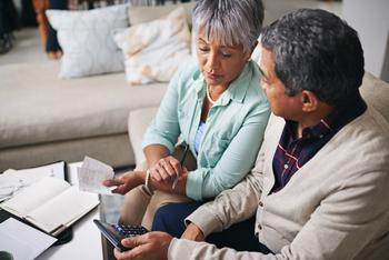 Running Out of Cash in Retirement? 4 Better Options Than Taking On Debt: https://g.foolcdn.com/editorial/images/690316/seniors-looking-at-calculator-and-receipts.jpg