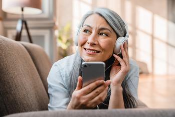 Over 50? 3 Millionaire Moves to Make in 2024: https://g.foolcdn.com/editorial/images/760994/listening-to-phone-podcast-music.jpg