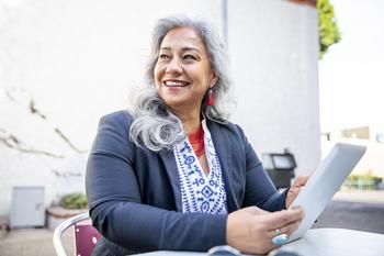 The Most Important Retirement Table You'll Ever See: https://g.foolcdn.com/editorial/images/775868/person-smiling-and-holding-a-tablet.jpg