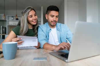 Why SoFi Stock Lost 24% in August: https://g.foolcdn.com/editorial/images/746418/two-people-looking-at-a-computer.jpg