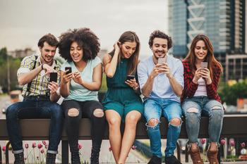 Mark Zuckerberg Says 10 Million Users Have Already Signed Up for Threads, Meta's New Rival to Twitter: https://g.foolcdn.com/editorial/images/738782/a-number-of-people-sitting-on-a-bench-and-smiling-while-looking-at-smartphones.jpg