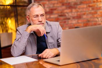 Will You Regret Claiming Social Security at 62?: https://g.foolcdn.com/editorial/images/770438/older-man-laptop-serious-gettyimages-1435079623.jpg