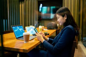 3 Magnificent ETFs That Could Help You Beat the Market With Next to No Effort: https://g.foolcdn.com/editorial/images/777042/person-sitting-in-front-of-a-laptop-looking-at-a-phone.jpg