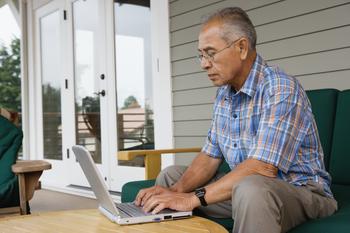 Turning 66 This Year? You Might Still Want to Wait on Social Security.: https://g.foolcdn.com/editorial/images/760851/older-man-laptop-outdoors-gettyimages-56957014.jpg